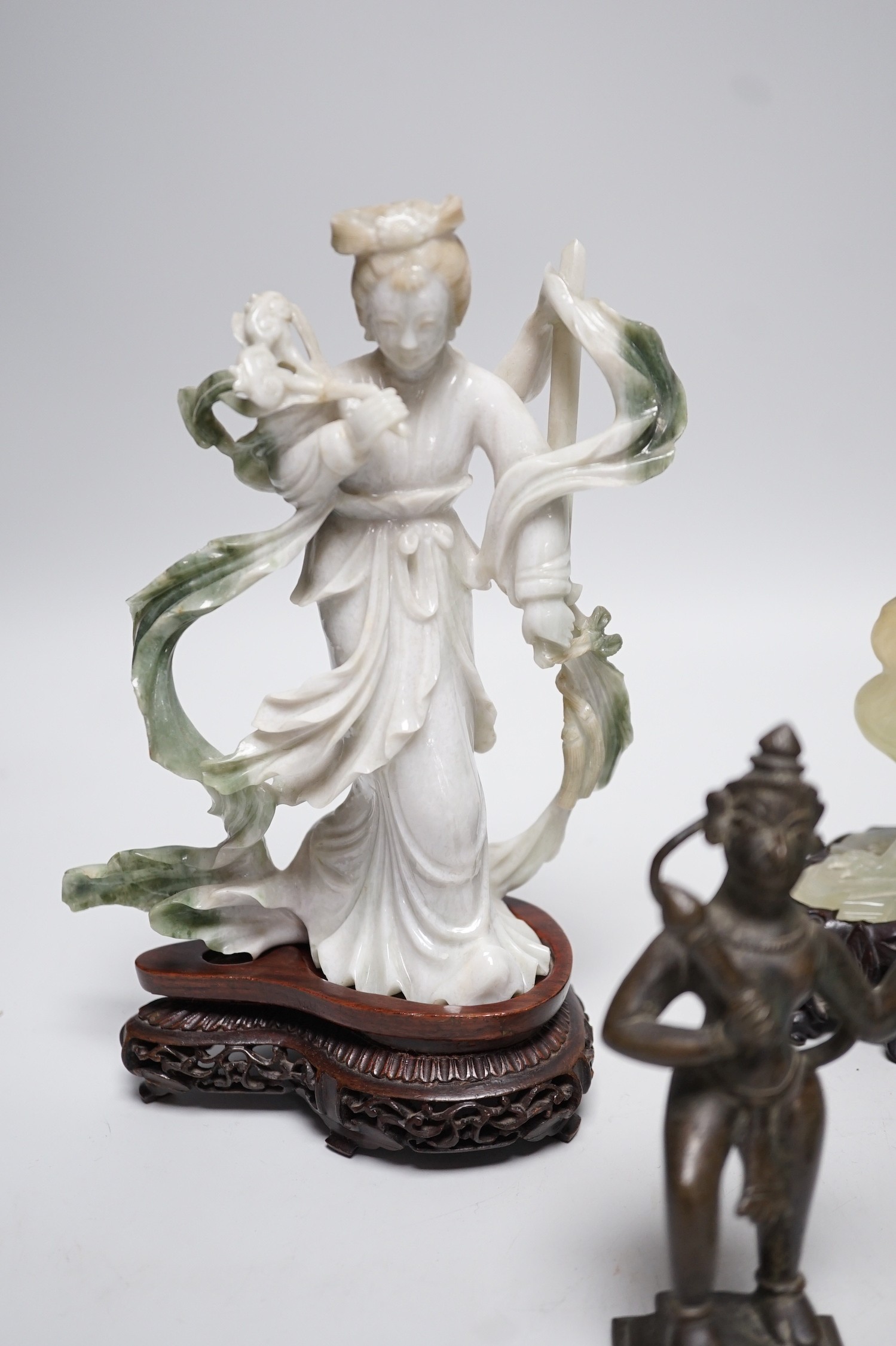 A Chinese bowenite jade bird group, together with a Jadeite figure of lady, 19.5cm high, a bowenite model of a goldfish, and an Indian brass figure